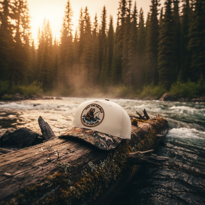 Bearfoot Camo Bill Hat lifestyle shot by the river