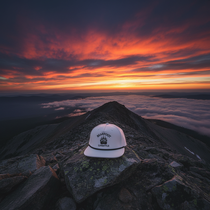 Bearfoot Classic Snapback Hat lifestyle shot at sunset summit