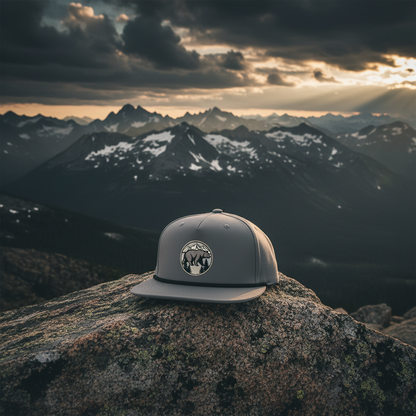 Bearfoot Bear Patch Snapback Hat lifestyle shot at mountain summit